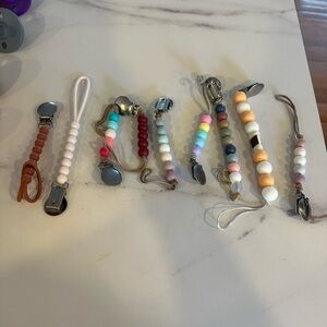 Ryan and Rose Cutie pats, Cutie clips, a teether, and some Itzy ritzy mixed in!